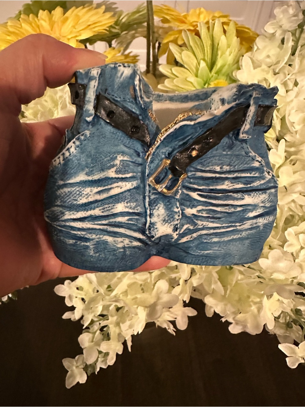 Vintage ceramic planter shaped like a pair of high-waisted denim blue jeans